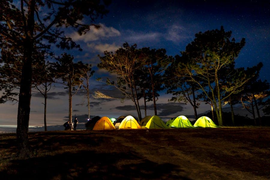 A tent at a forest campsite in the evening